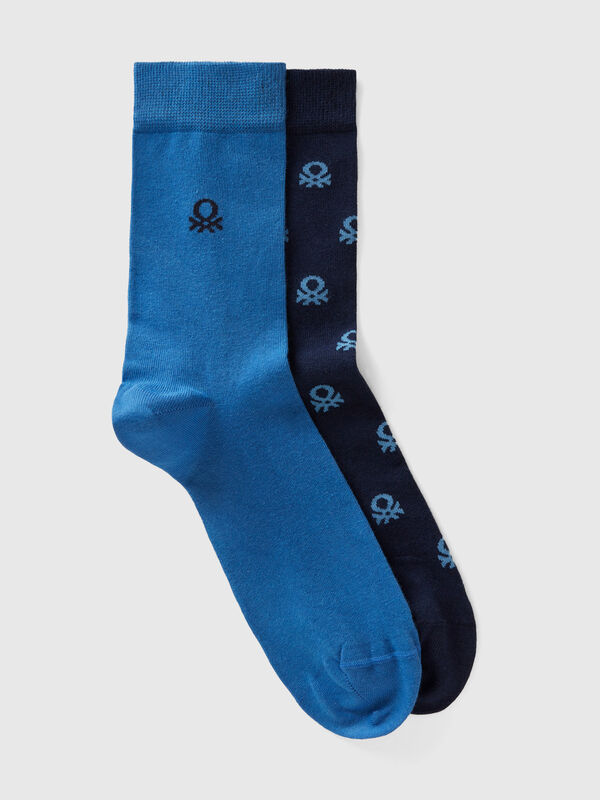 Two pairs of long socks with logos